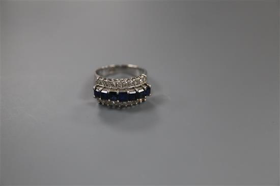 A modern 18k white metal and three row sapphire and diamond set dress ring, size O, gross weight 6.5 grams.